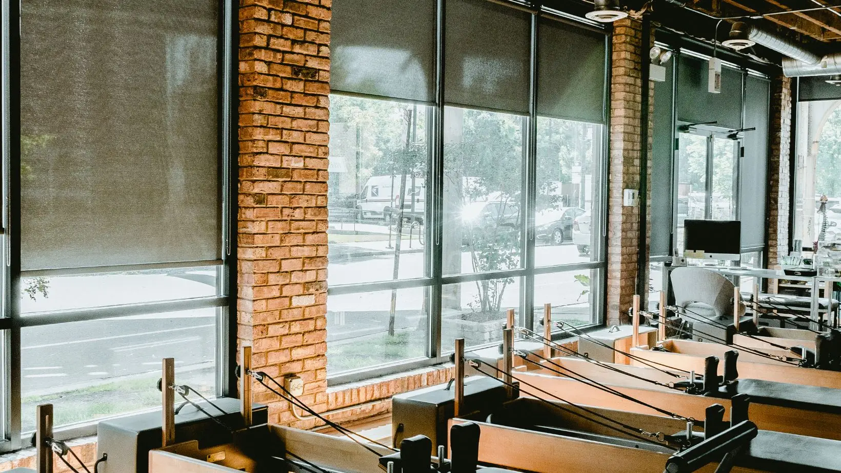 Bright fitness studio with wooden equipment