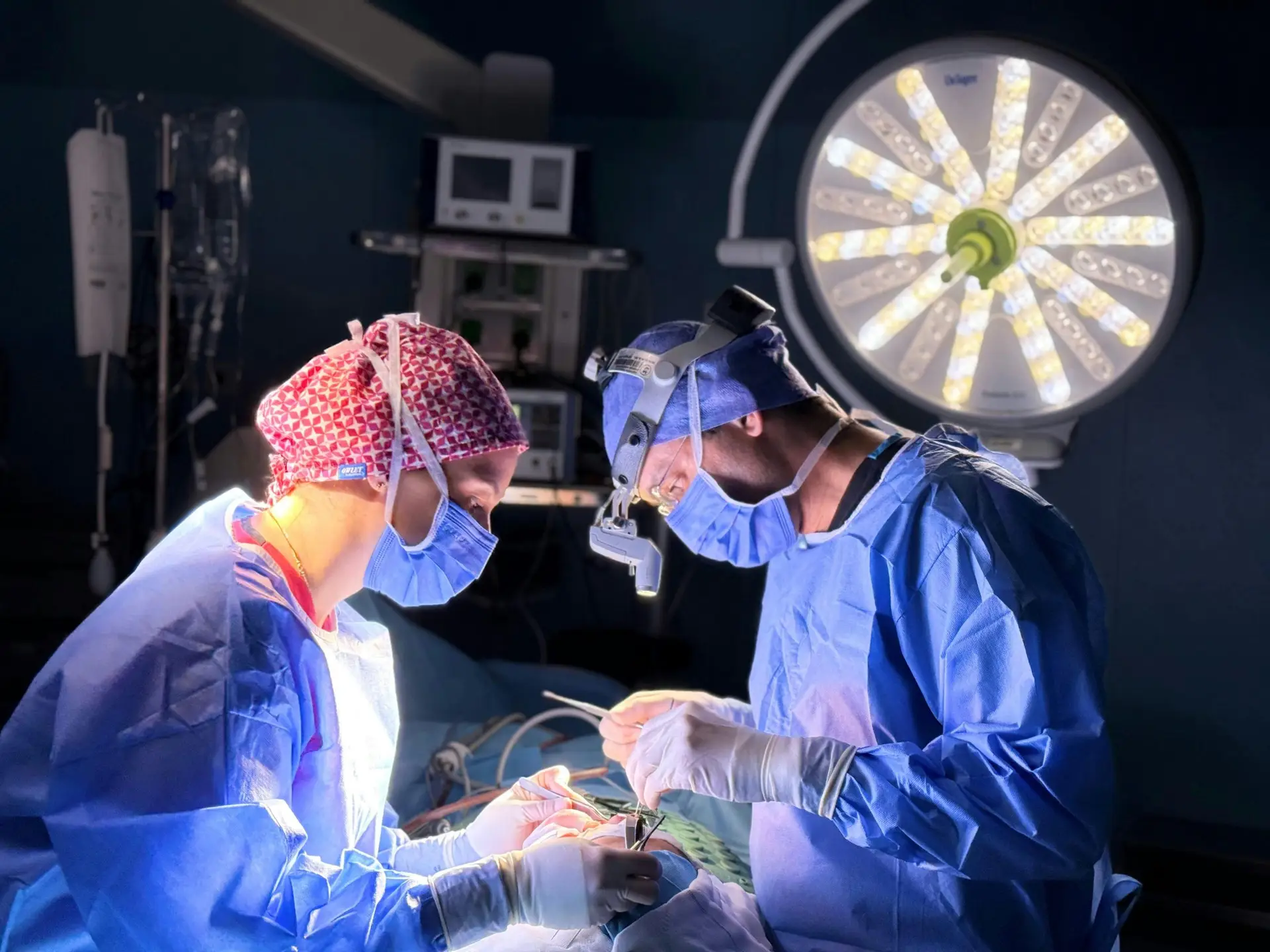 Professional surgical team in action in an operating room with focus on precision and teamwork.