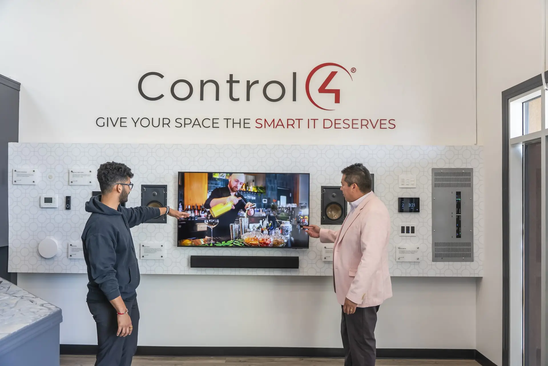 Control4 Certified Showroom Two people discussing smart home technology.