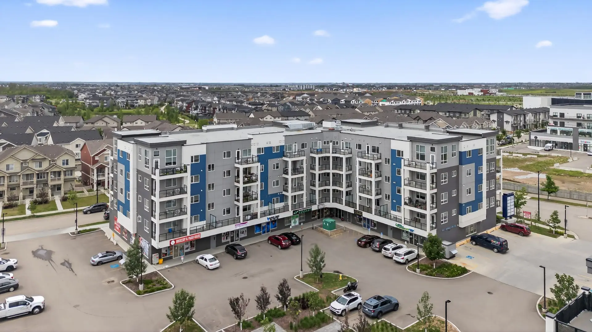 Multi-Dwelling Buildings Modern apartment building with parking lot